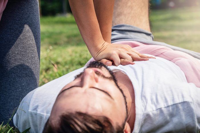 close up of woman giving man cpr