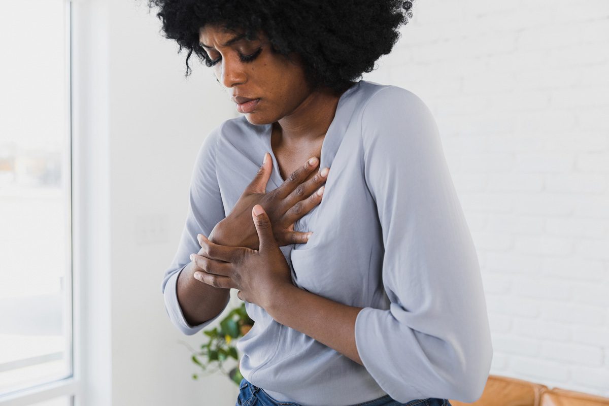 woman holding her chest